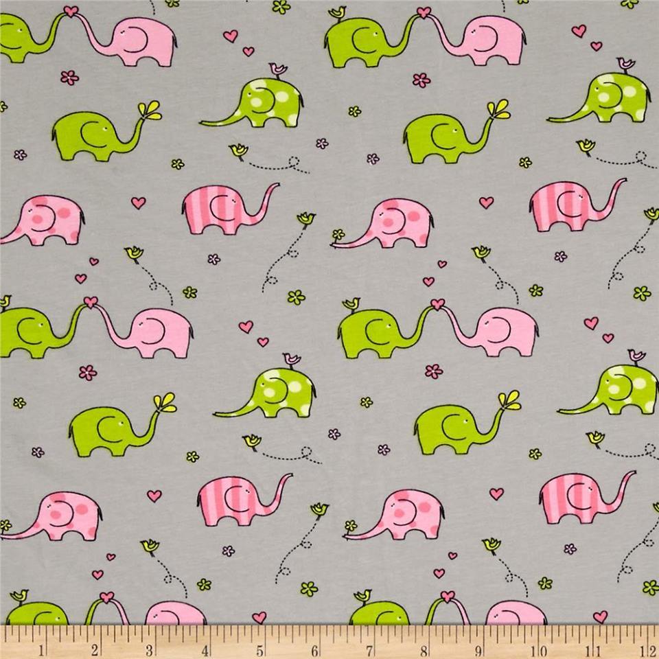 Elephants knit by Springs Creative features pink and green elephants on ...